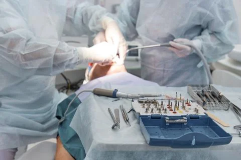 The dentist's tools are on the table, the doctors perform dental surgery in the Stock Photos