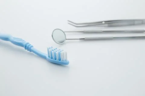 Dentist's tools on white background Stock Photos