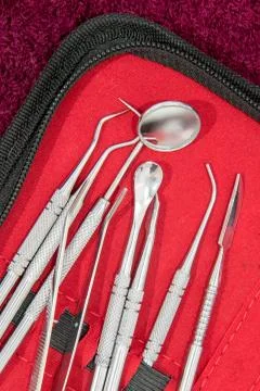 Denture tool on red bag Stock-Fotos