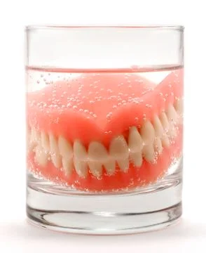 Dentures in the glass Stock Photos