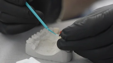 Dentures on table in clinic Stock Footage 89976439