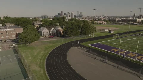Denver city skyline while man runs on track healthy lifestyle Stock Footage 221461775