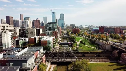 Denver cityscape aerial view with bridges over cherry creek river Stock Footage
