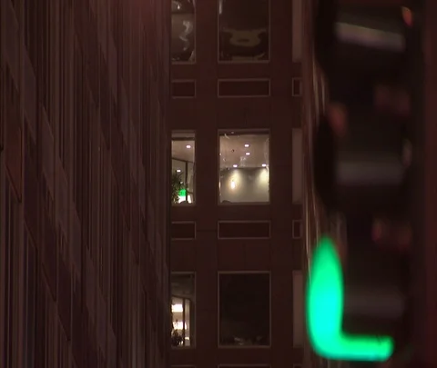 Denver, CO; MS illuminated window in high rise, changing traffic light Stock-Footage 86748092