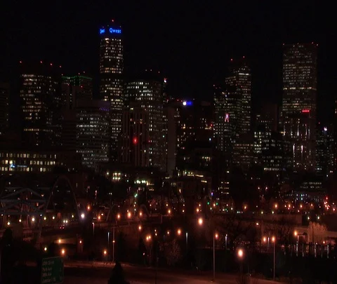 Denver, CO; WS Night time Denver skyline with city lights and passing traffic Stock Footage 86748028