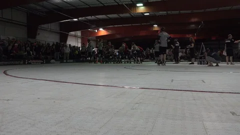 DENVER COLORADO-2015: Roller Derby Team Comes In To Circle To Stretch While Stock Footage 129352152