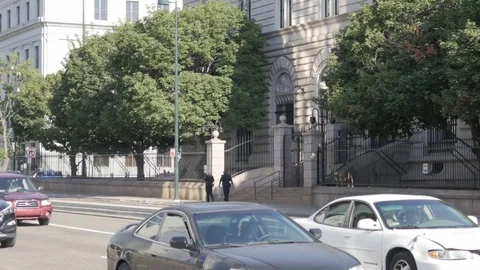 Denver US Mint Exterior Close Up with Police Men Walking and Traffic Stock Footage 85197781