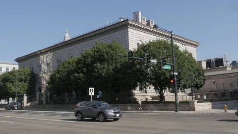 Denver US Mint Exterior with Two-Way Traffic, Turning Cars, and Pedestrians Stock Footage 85198298
