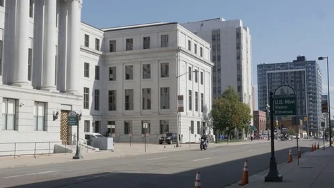Denver US Mint Visitor Entrance Sign with Passing Motorcycle Stock Footage 85204367