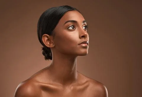 Denying the errors of my ancestors. Side shot of a beautiful young woman posing Stockfoto's