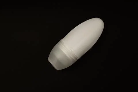 Deodorant in a white package on a black background Stock Photos