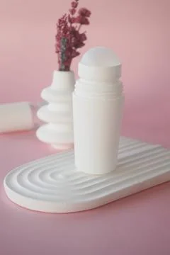 Deodorants and cream container on table 스톡 사진