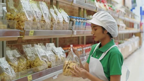 Department store concept of 4k Resolution. Asian female staff filling up the  Stock Footage 146852708