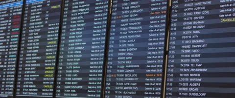 Departure board with timetable, gate info and schedule in airport terminal Stock Footage 130320608