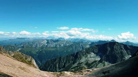 Departure of the quadcopter from behind the mountain 動画素材 138443146