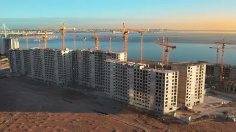 Departure from the residential complex under construction at sunset. Stock Footage 185462978
