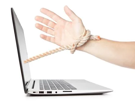 Dependence of man on the computer. Concept technology development. Stock Photos