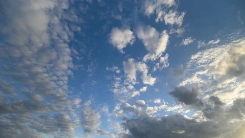 The Depiction of Dramatic Cloud Patterns Against a Beautiful Bright Blue Sky Abo Stock Footage 316297450