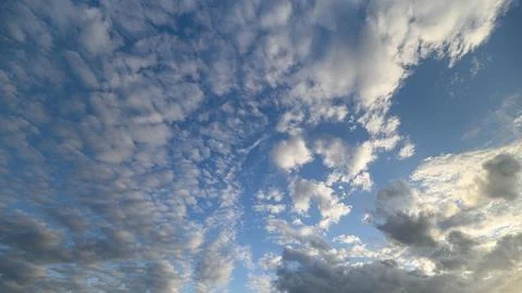The Depiction of Dramatic Cloud Patterns Against a Beautiful Bright Blue Sky Abo Stock Photos