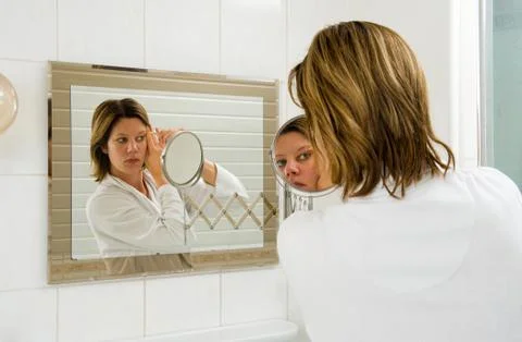 Depilating the eyebrow Foto stock