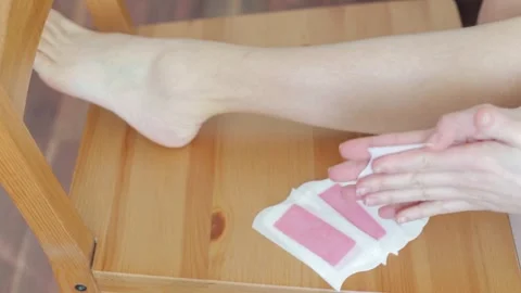 Depilation of legs using special strips. Self care concept. Video stock 269301458