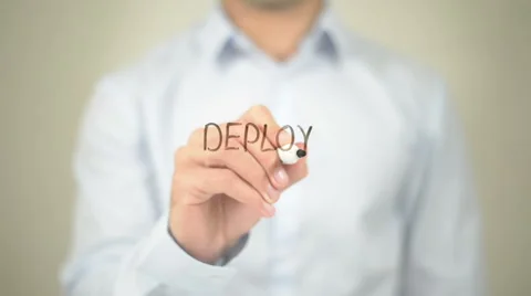 Deploy, Man writing on transparent screen Stock Footage 62828064