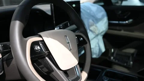 Deployed Airbag and Steering Wheel in Damaged Lincoln Corsair Car Interior .. Stock Footage 311006013