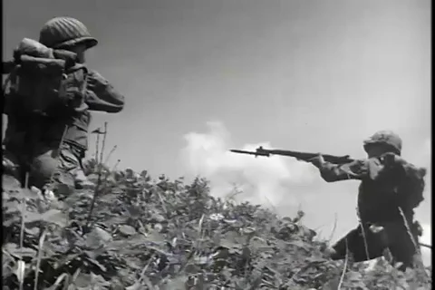 Deployed infantrymen advance up hillside and fire - 1953 Stock Footage 93004352