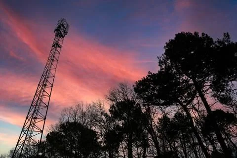Deployment of the 5G network. Laying antennas on a mobile phone mast in the Stock Photos