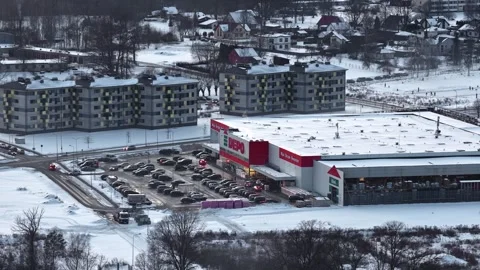 DEPO retail store operating during winter, surrounded by a parking lot, cars Stock-Footage 336300481
