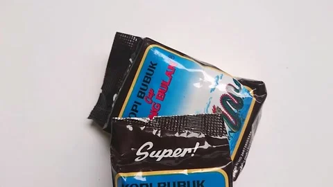 Depok, bogor, west java, indonesia traditional local arabica coffee small pack Stock Footage 218411355