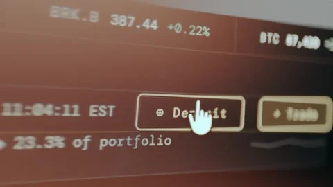 Deposit and Trade buttons within the interface of a trading platform Stock Footage 331145924