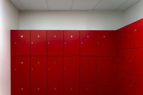 Deposit red locker boxes or gym lockers inside of a room Stock Photos