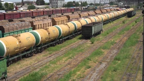 Depot Station of a Train Wagons loaded with Fuel Oil Wood on Railway Tracks Stock Footage 237470525