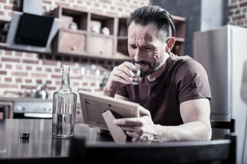 Depressed bearded man grieving Stock Photos