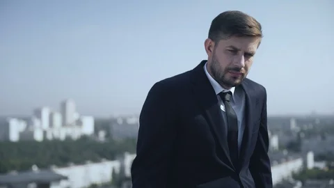 Depressed businessman thinking of work problem outdoors, crisis hopelessness Stock-Footage 117209817