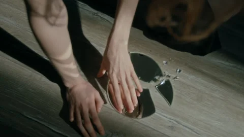 Depressed Girl Looking at Her Reflection in Broken Mirror Touching Shard 動画素材 301103645
