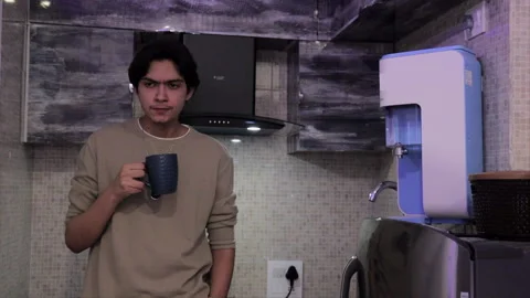 Depressed guy drinking coffee Stock Footage 157791064