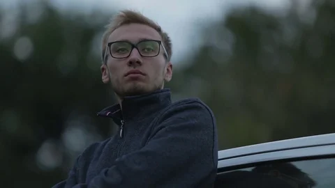 Depressed guy looks into the distance Stock-Footage 71603104