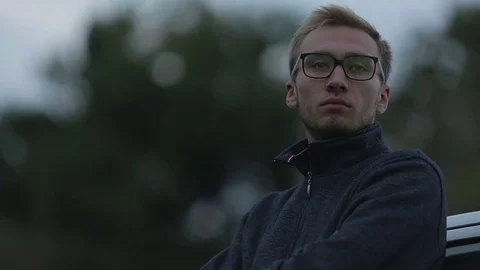 Depressed guy looks into the distance Stock-Footage 71603396