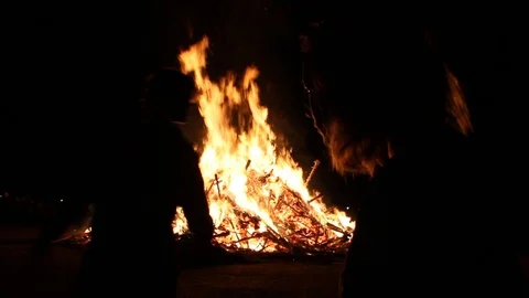 Depressed kid by the fire Stock Footage 122355655