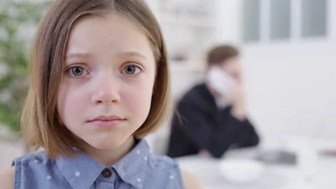 Depressed kid looking at camera, busy father working on background, attention Stock Footage 150147616