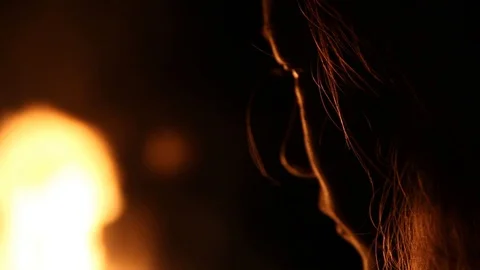 Depressed kid watching fire burn Stock Footage 122355761