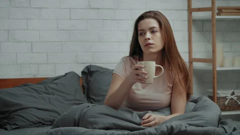 Depressed Lady Drinking Coffee Sitting In Bed In Dark Bedroom Stock Footage 153016756