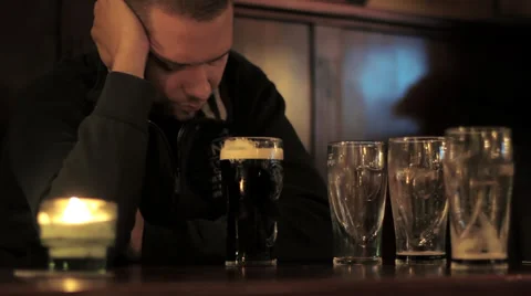 Depressed man with beer Stock Footage 32680186