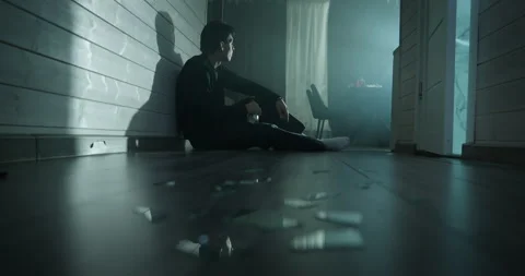 Depressed man drink alcohol sitting floor at home. Alco addiction concept. Stock Footage 337955895