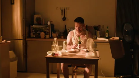 Depressed Man Drinking Alcohol Alone Suffering from Addiction Stock Footage 344876889