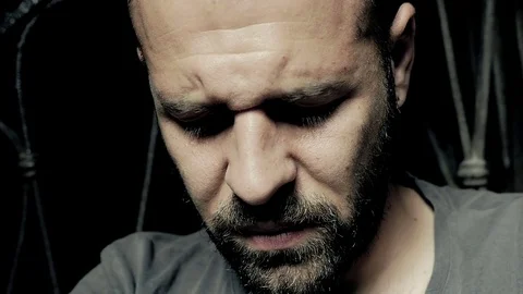 Depressed man fixed the camera in the darkness Stockbeeldmateriaal 71033001