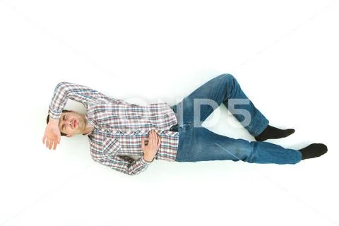The depressed man lay on the floor. View from above Stock Photos