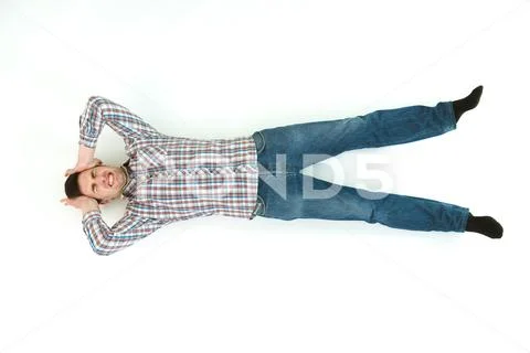 The depressed man lay on the floor. View from above Stock Photos